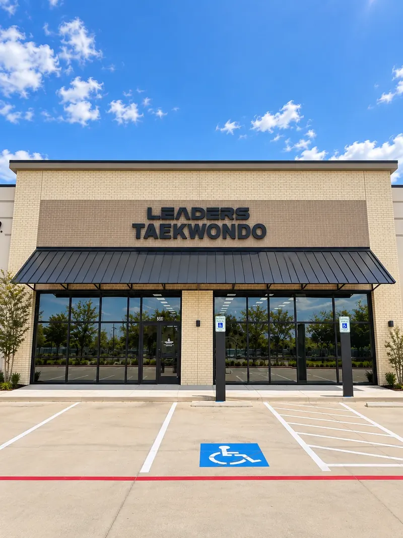 The front of Leaders Taekwondo Cypress with the Leaders Taekwondo sign above the entrance