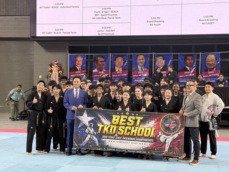 Leaders Taekwondo students and instructors behind a banner reading Best TKD School, 2026 Texas State Taekwondo Championships